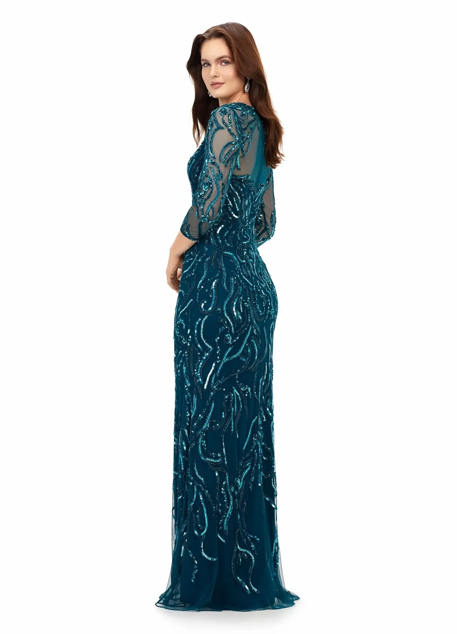 model is wearing a dark teal beaded floor length sheath gown