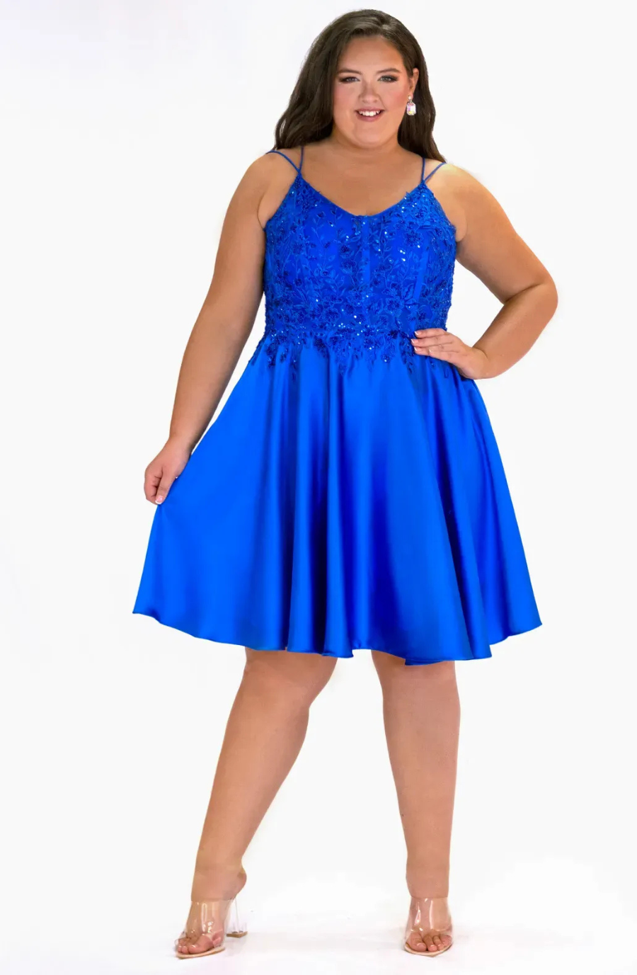 Model is wearing a sleeveless a-line short homecoming dress
